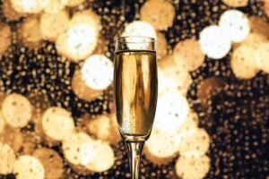 Champagne with a sparkly background.