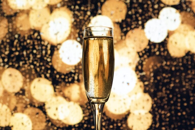 Champagne with a sparkly background.