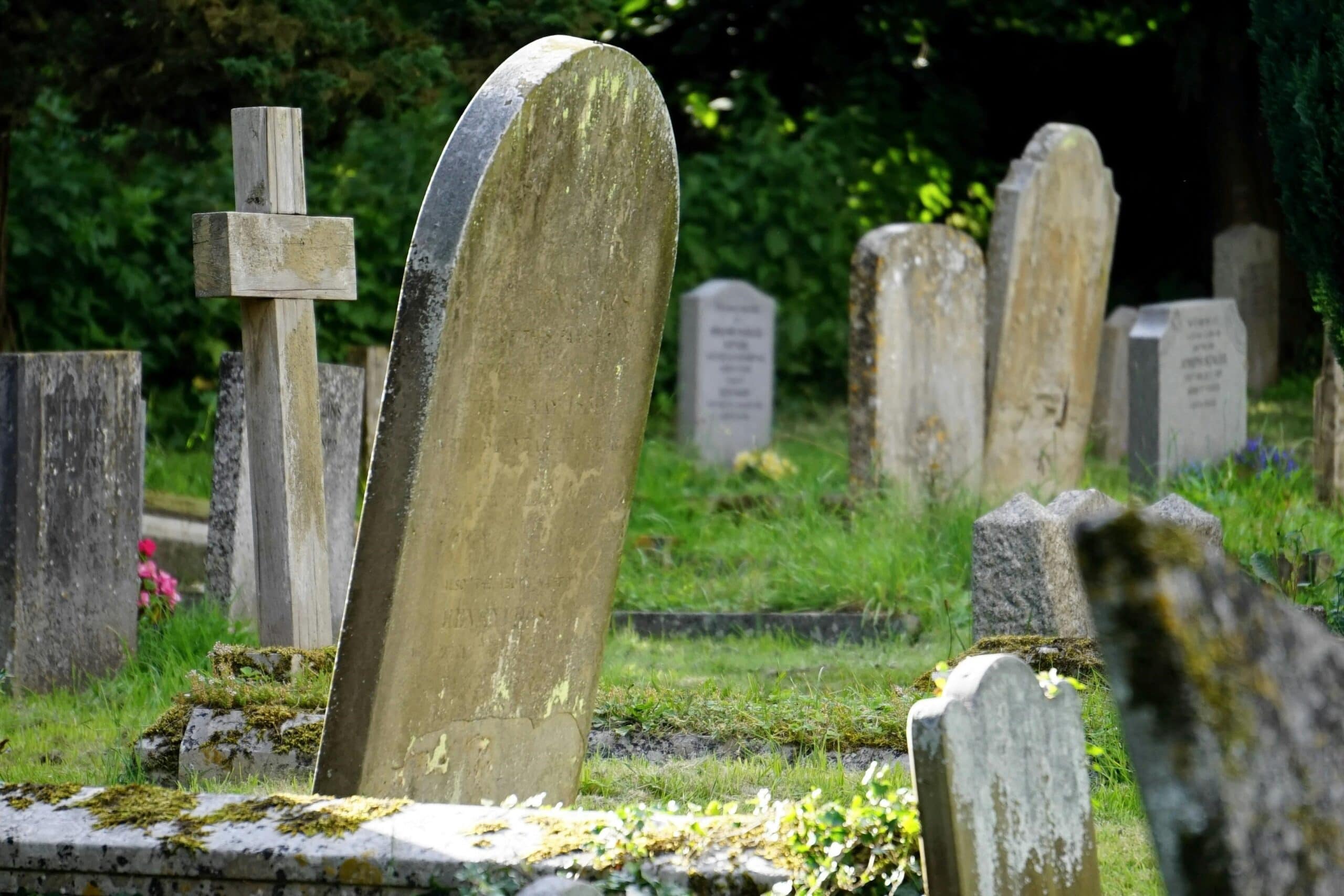 Graveyard with various shaped gravestones.