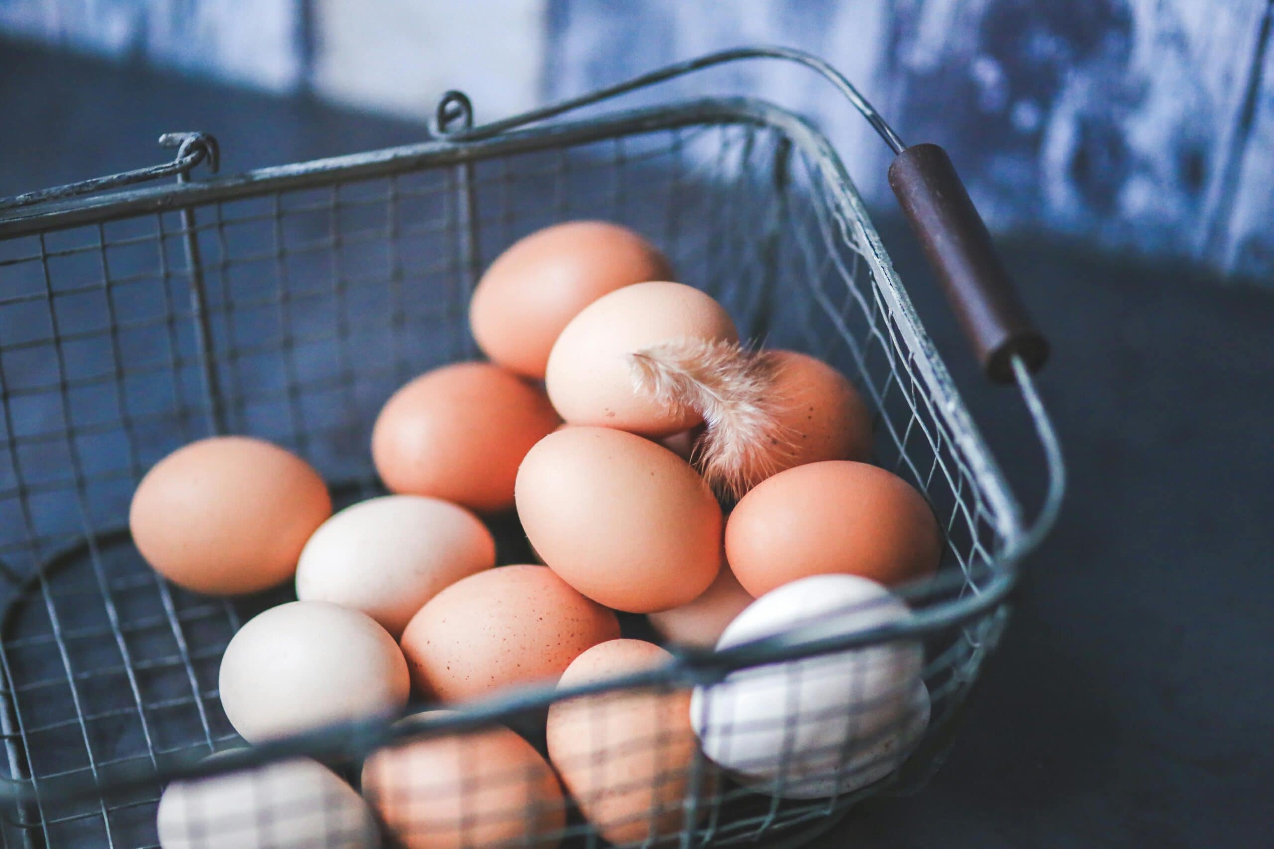 About a dozen eggs in a basket