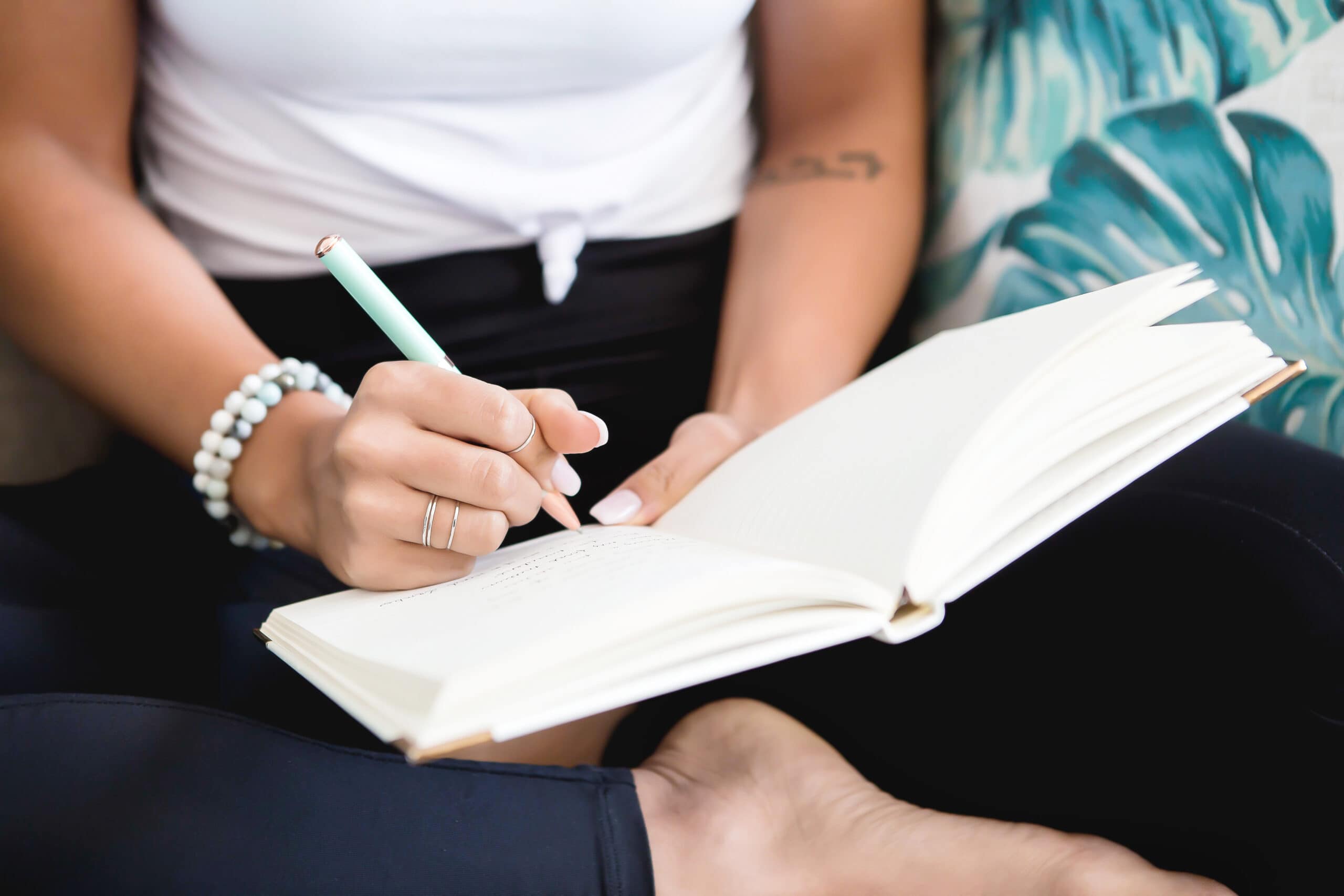 Woman writing in a notebook.