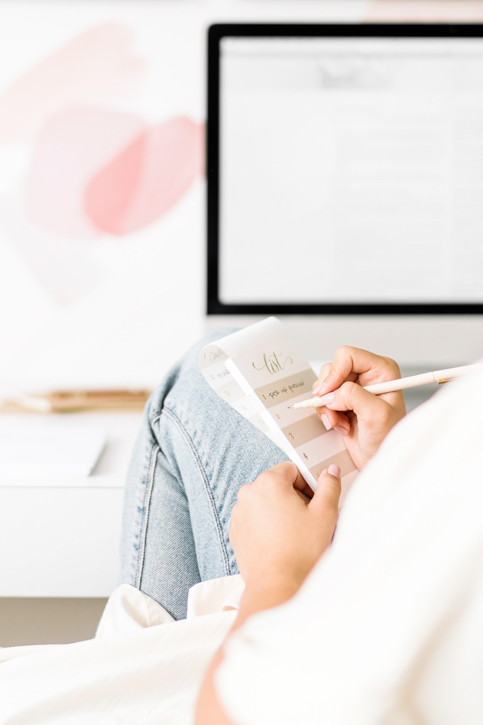 Woman writing a to do list