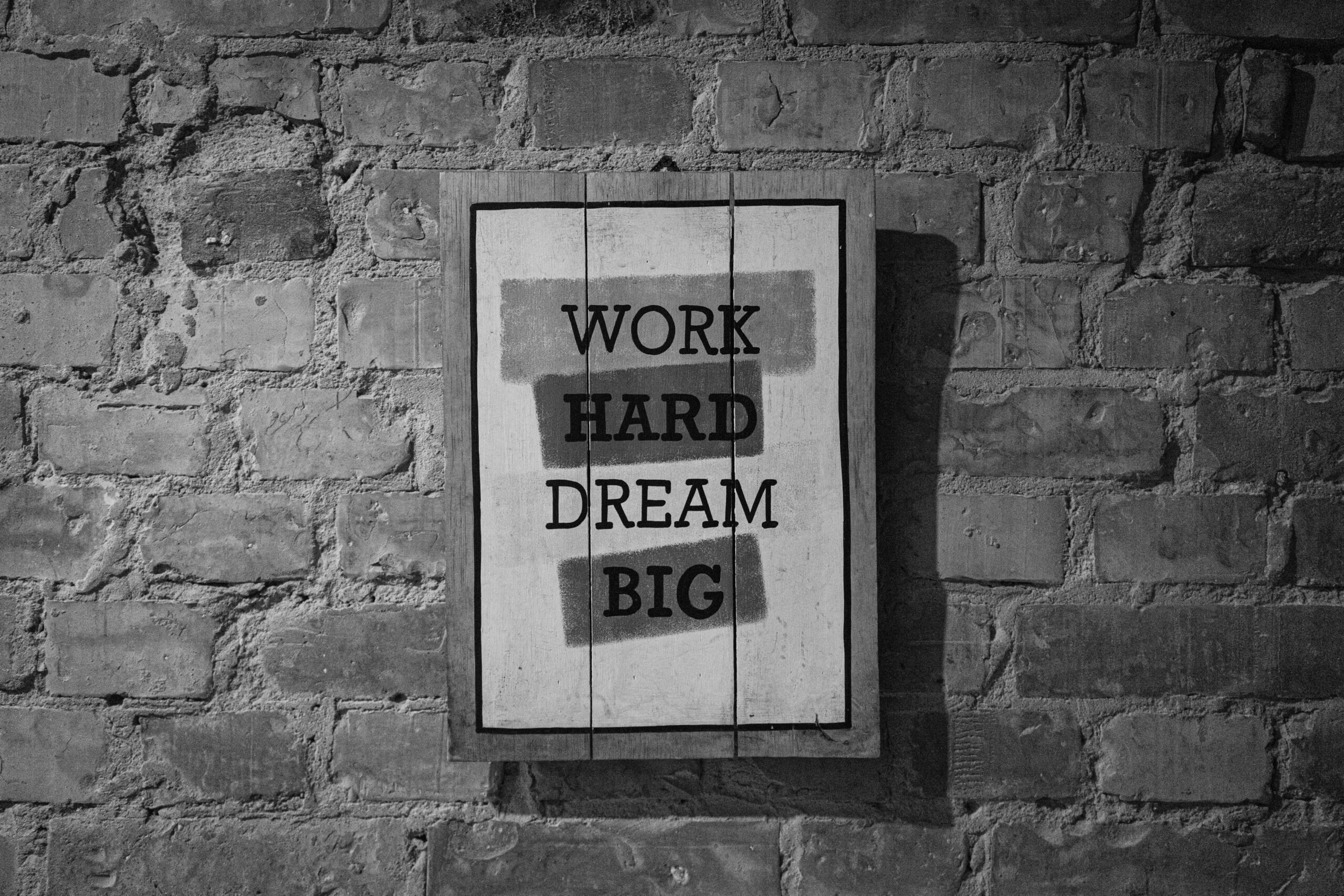 Sign which reads WORK HARD DREAM BIG